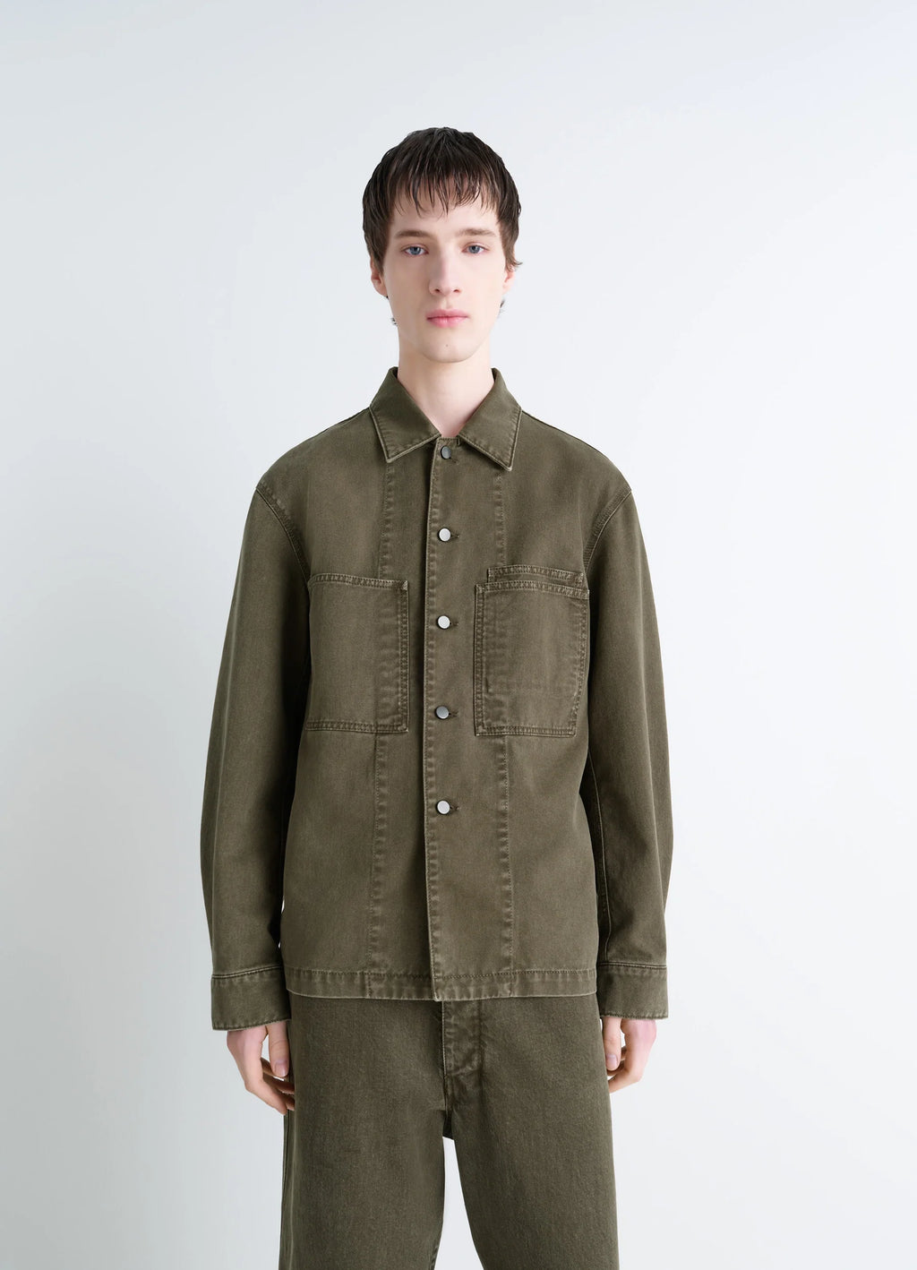 Lemaire Workwear Overshirt in Garment Dyed Snowy Denim, model shot, front view fitted cut, patch pockets