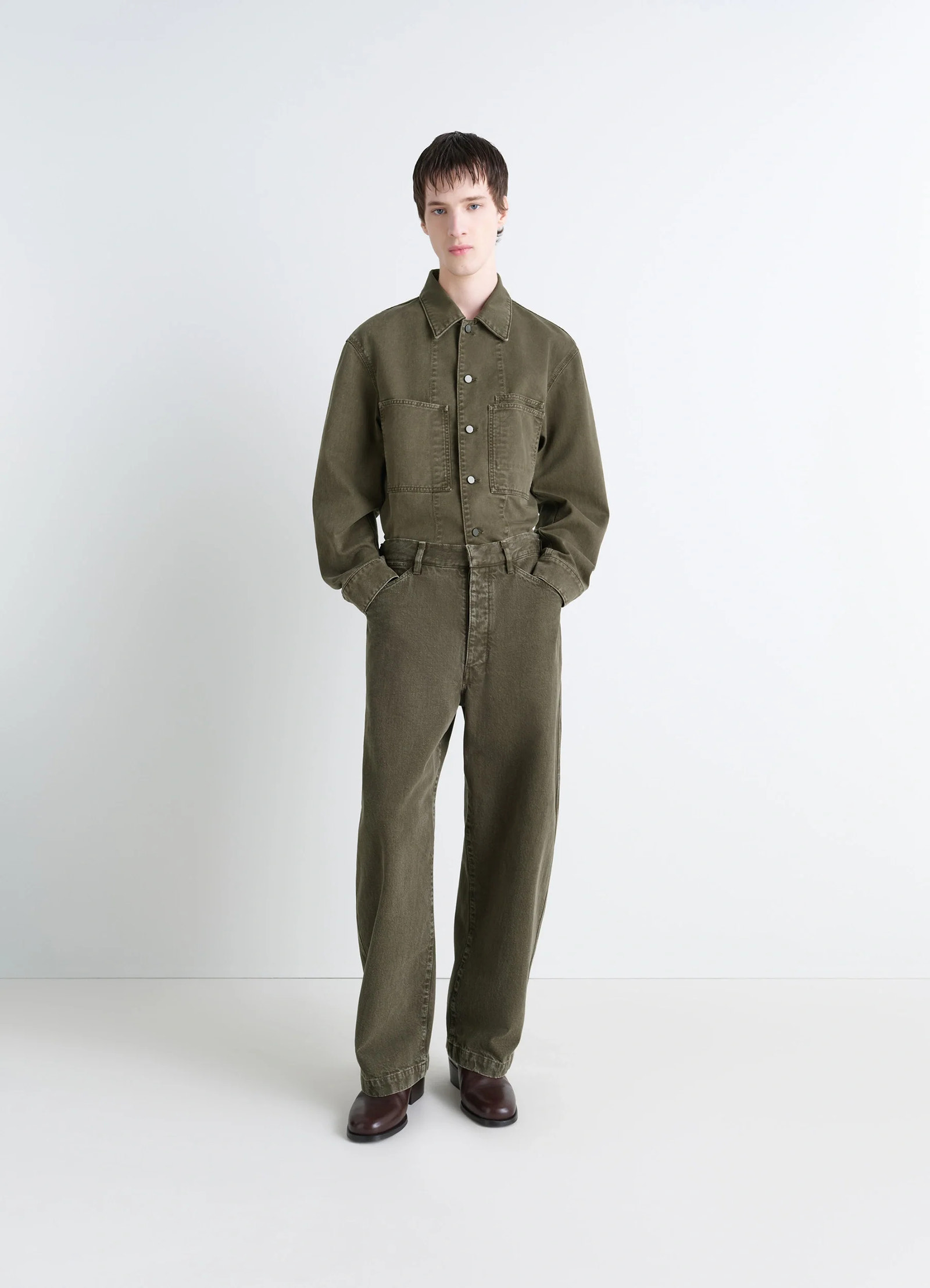 Lemaire workwear overshirt in garment dyed snowy denim, model shot, three-quarter view button-up front