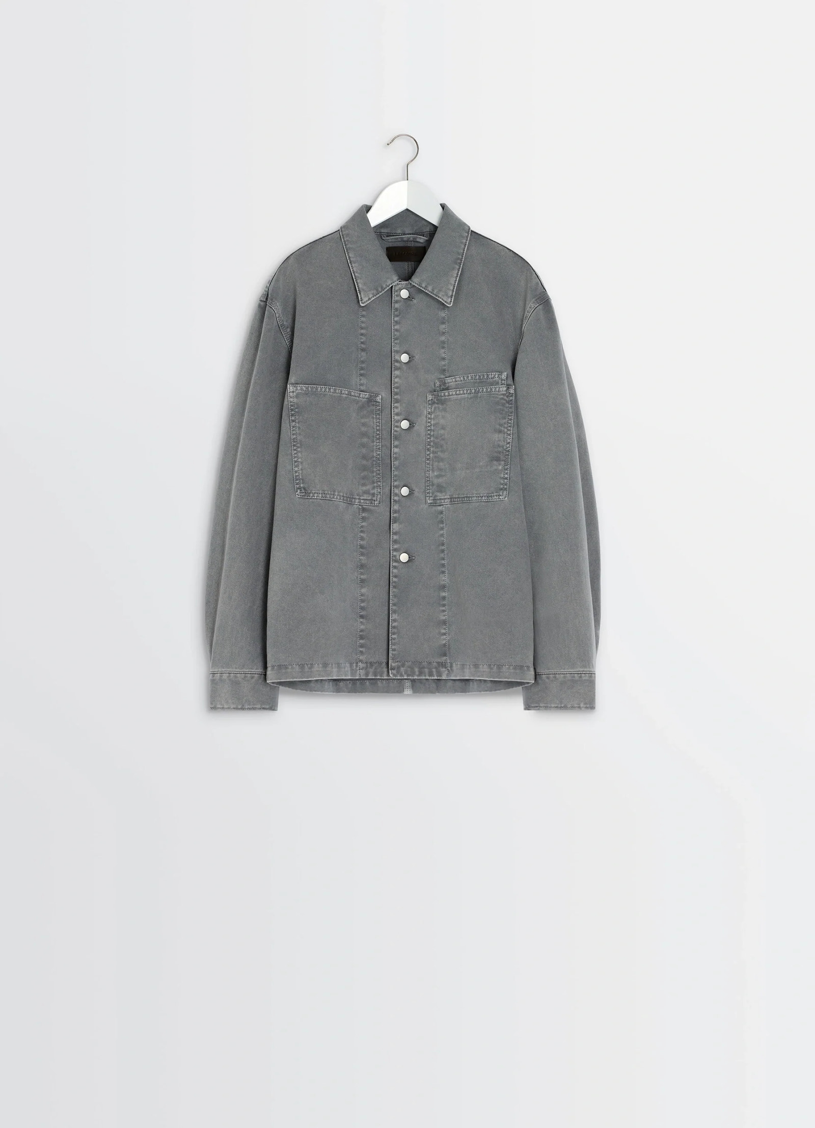 Lemaire workwear overshirt in garment dyed snow medium denim, product shot, side angle stitch detailing