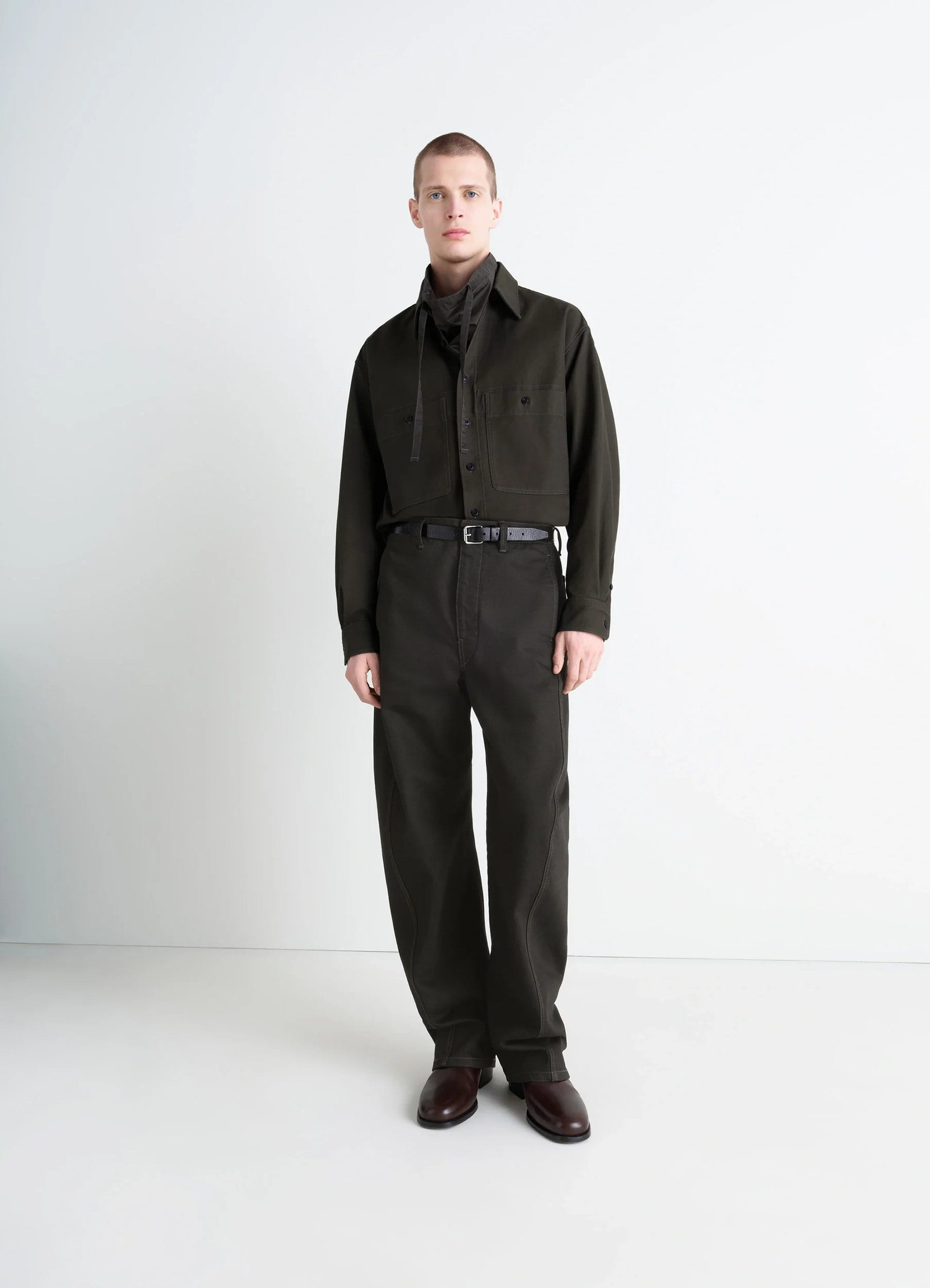 Utility overshirt in thick cotton twill, model shot, 3/4 view buttoned chest pockets