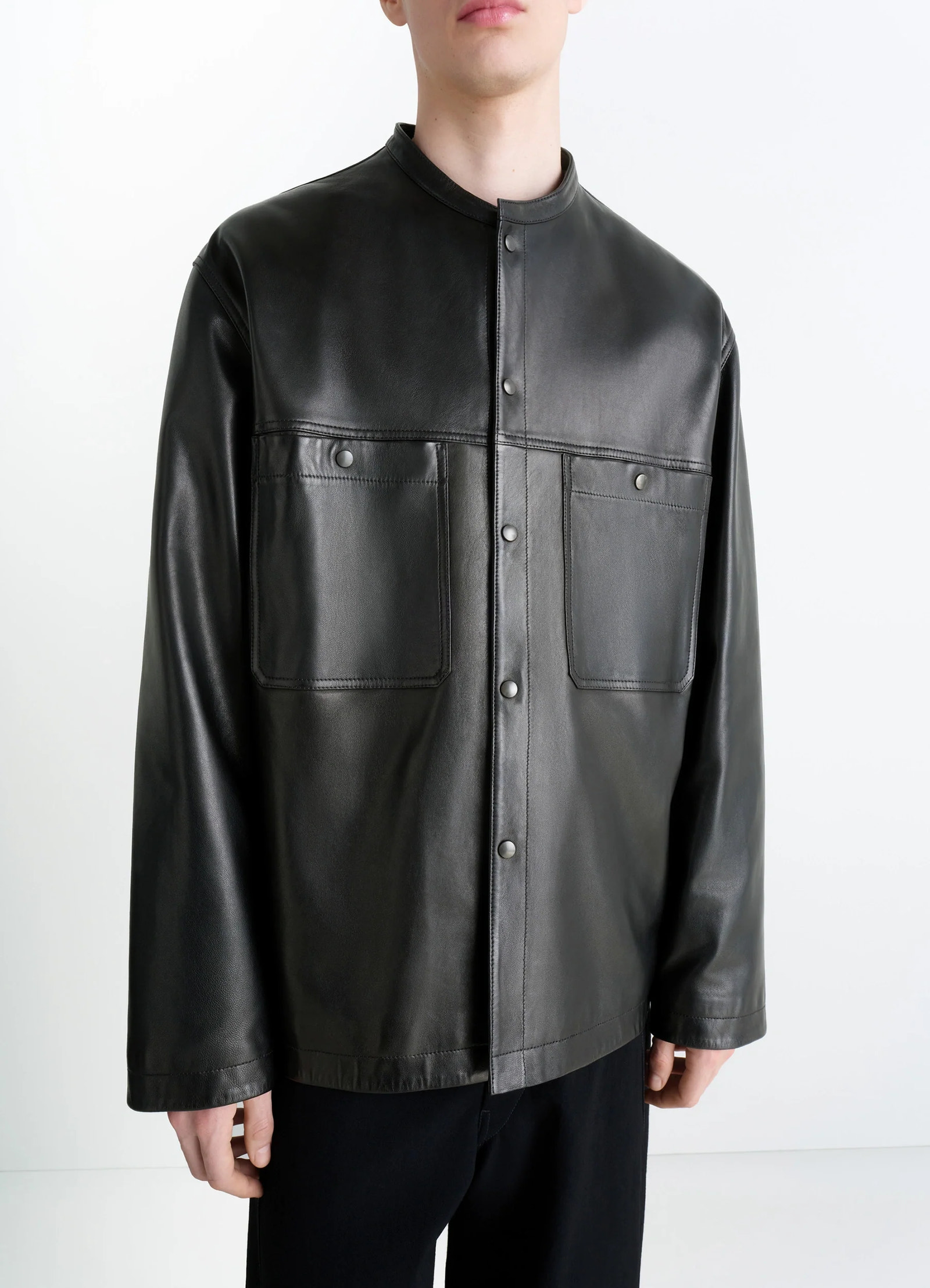 Leather collarstand overshirt in nappa lamb leather, model shot, three-quarter front view dual chest pockets