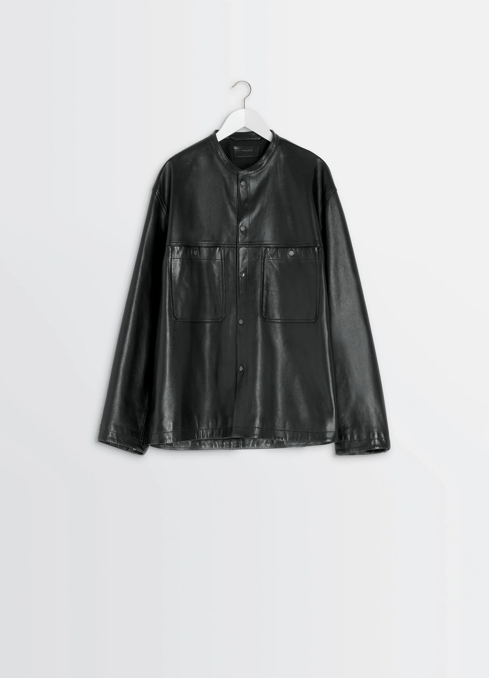 Leather collarstand overshirt in nappa lamb leather, product shot, hanger side view dropped shoulder design