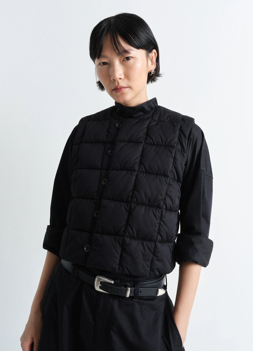Lemaire Wadded Gilet in Black Cotton Satin, model shot, upper body close-up boxy fit, high collar