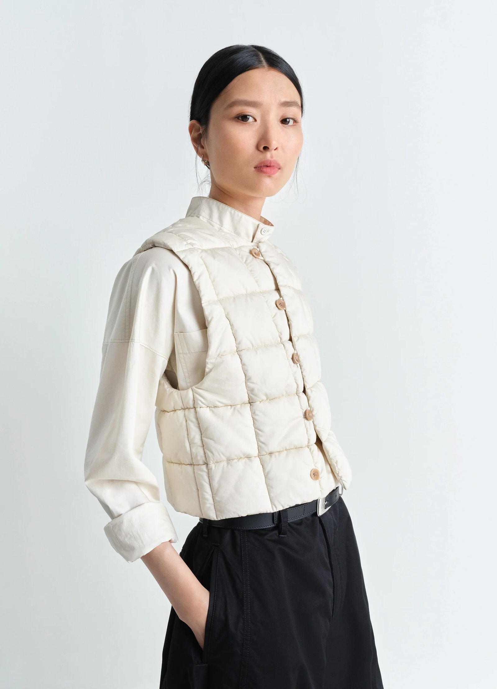Lemaire wadded gilet in light cotton satin, model shot, side view worn by model