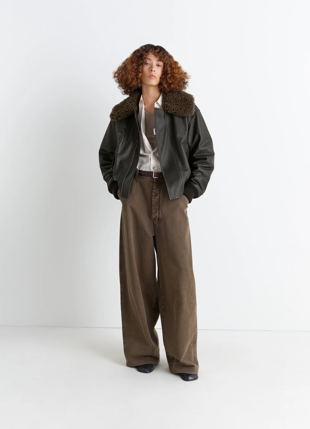 Lemaire Leather Blouson in Nappa Cow Leather Shearling, model shot, three-quarter view shearling collar open