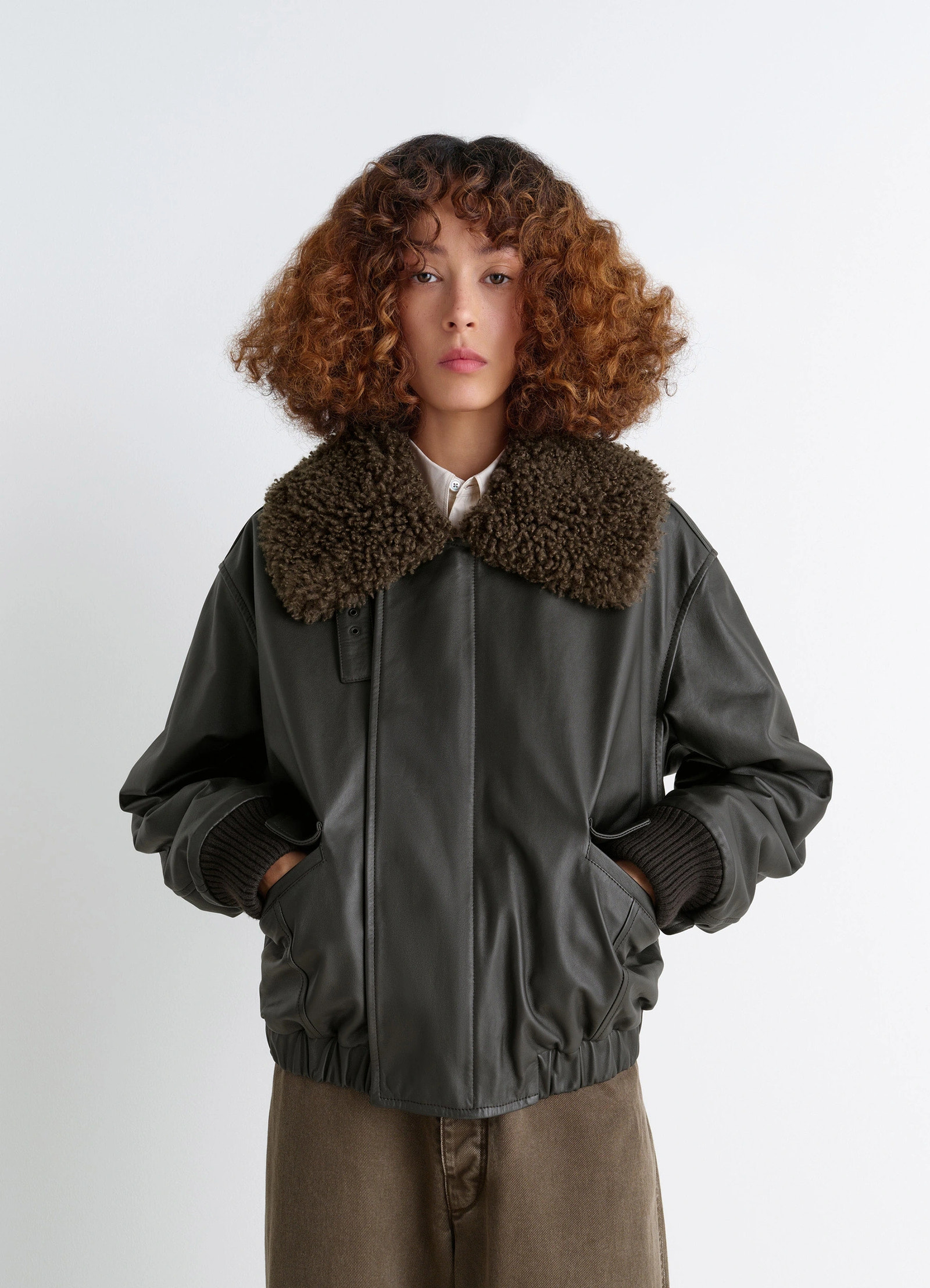 Lemaire leather blouson in nappa cow leather shearling, model shot, front view short jacket with fur collar