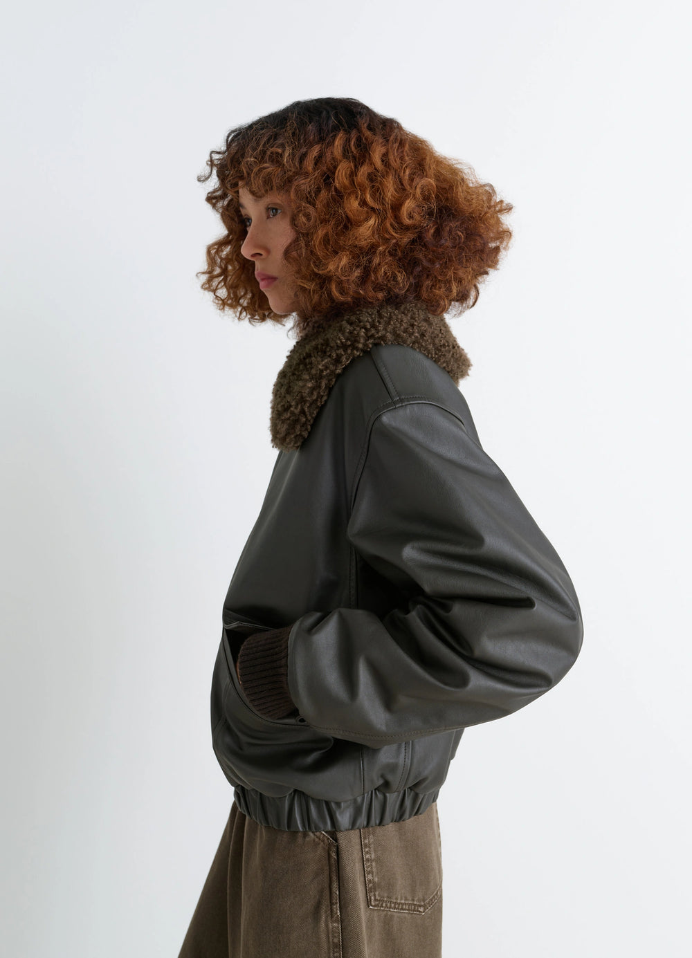 Lemaire Leather Blouson in Nappa Cow Leather Shearling, model shot, side view elastic hem, wrist cuffs