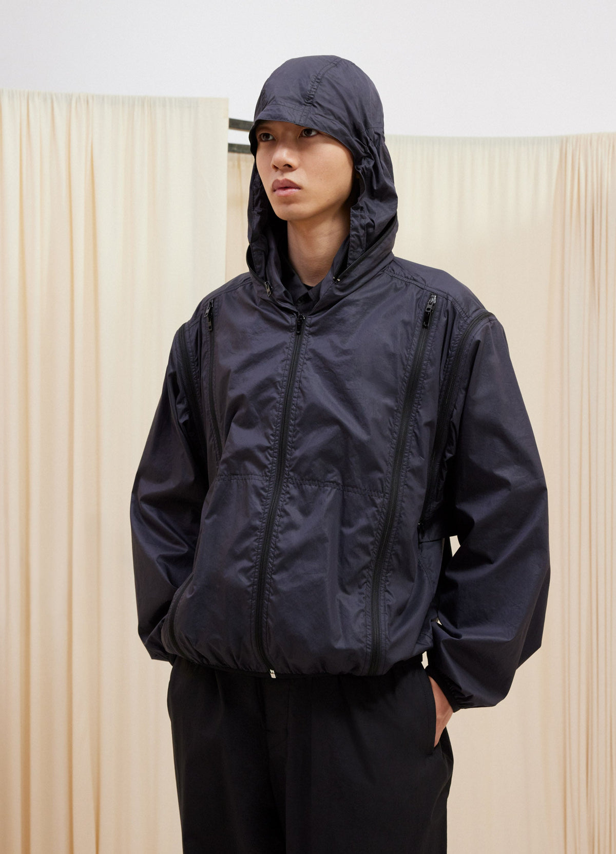 Lemaire Zipped Hooded Blouson in Light Technical Cotton Chintz, model shot, Front side view Detachable sleeves hooded