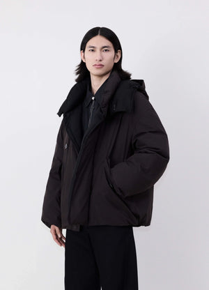 Lemaire Hooded Puffer Blouson in Dark cotton blend, model shot, Front side view Detachable peaked hood