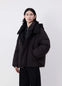 Lemaire Hooded Puffer Blouson in Dark cotton blend, model shot, Front side view Detachable peaked hood