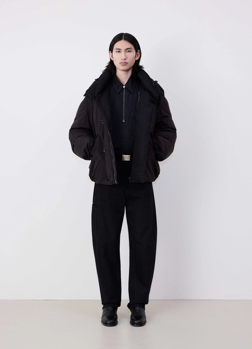 Lemaire Hooded Puffer Blouson in Dark cotton blend, model shot, full body front view felted collar detail
