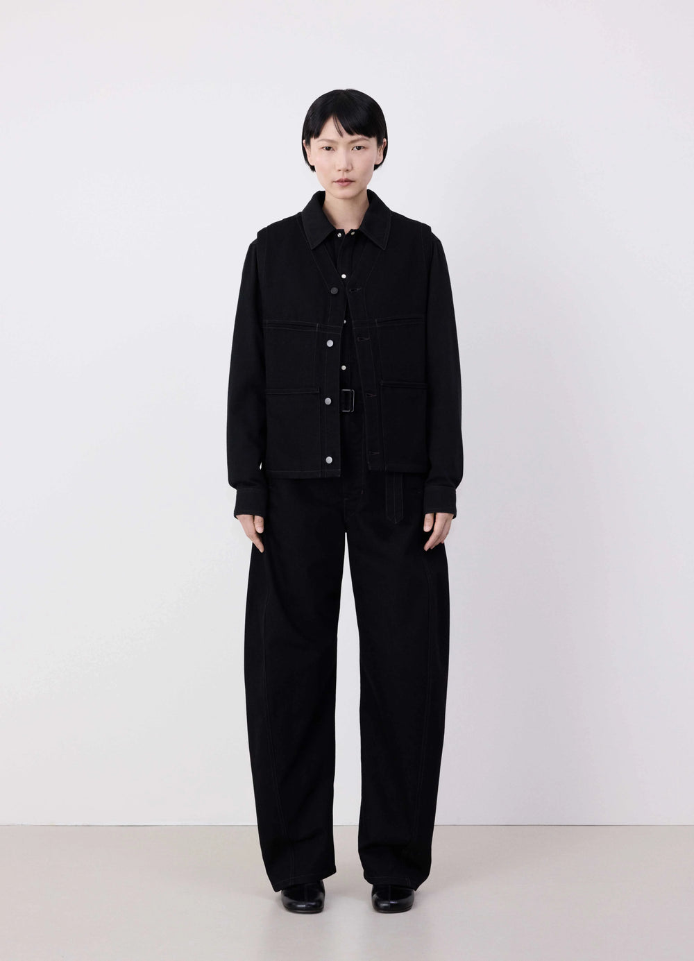 Lemaire Sleeveless Gilet in Deep Black Denim, model shot, front view button-up front