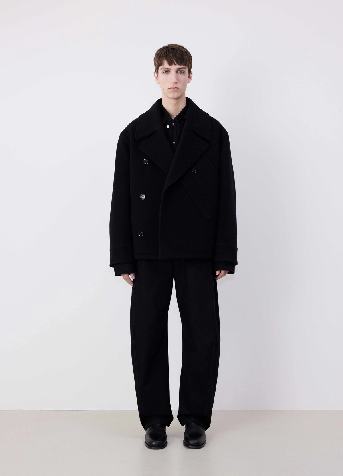 Lemaire Dispatch Peacoat in Black Heavy Double-Sided Wool, model shot, Front View Peaked Lapel Double-Breasted