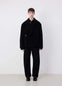 Lemaire Dispatch Peacoat in Black Heavy Double-Sided Wool, model shot, Front View Peaked Lapel Double-Breasted