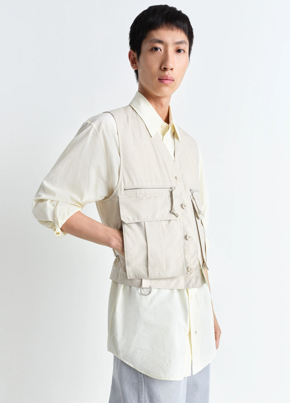 LEMAIRE Technical Gilet in Heather Garment Dyed Snow VENTILE c, model shot, side view button-up with vented pockets