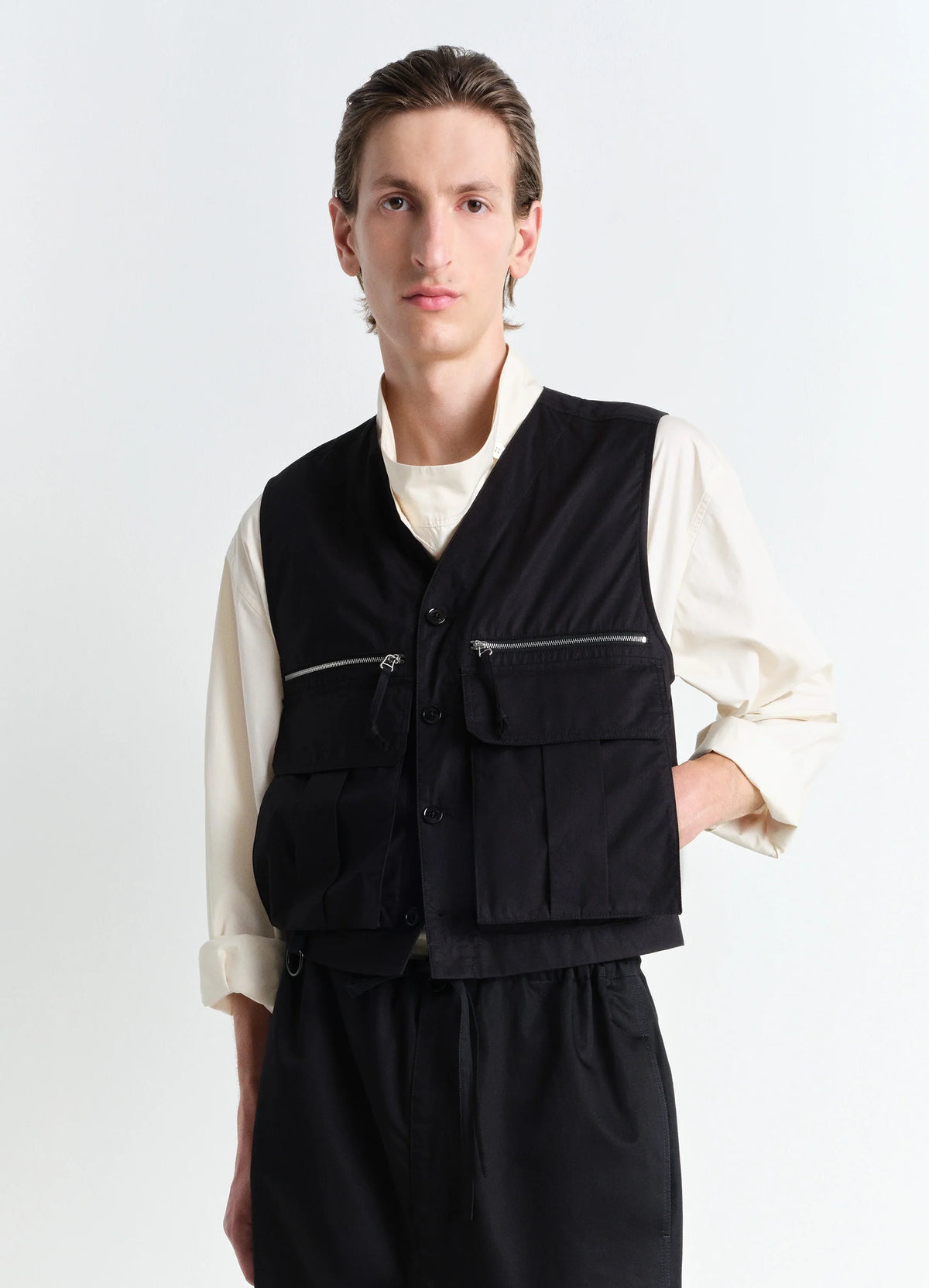 Lemaire Collarless Gilet in Black VENTILE Cotton, model shot, front view utilitarian fitted