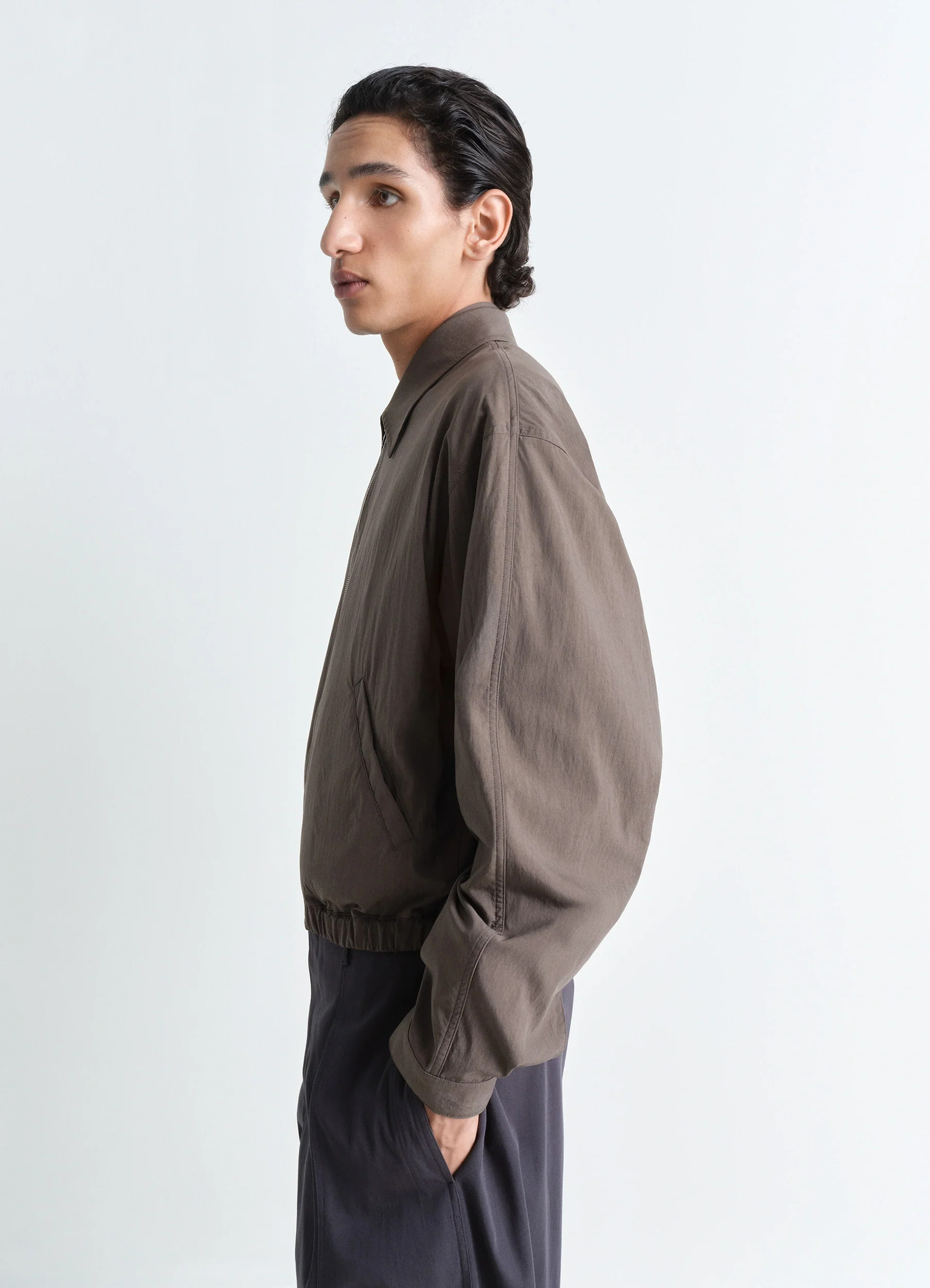 Zipped blouson in technical lyocell, model shot, side profile relaxed fit long sleeve