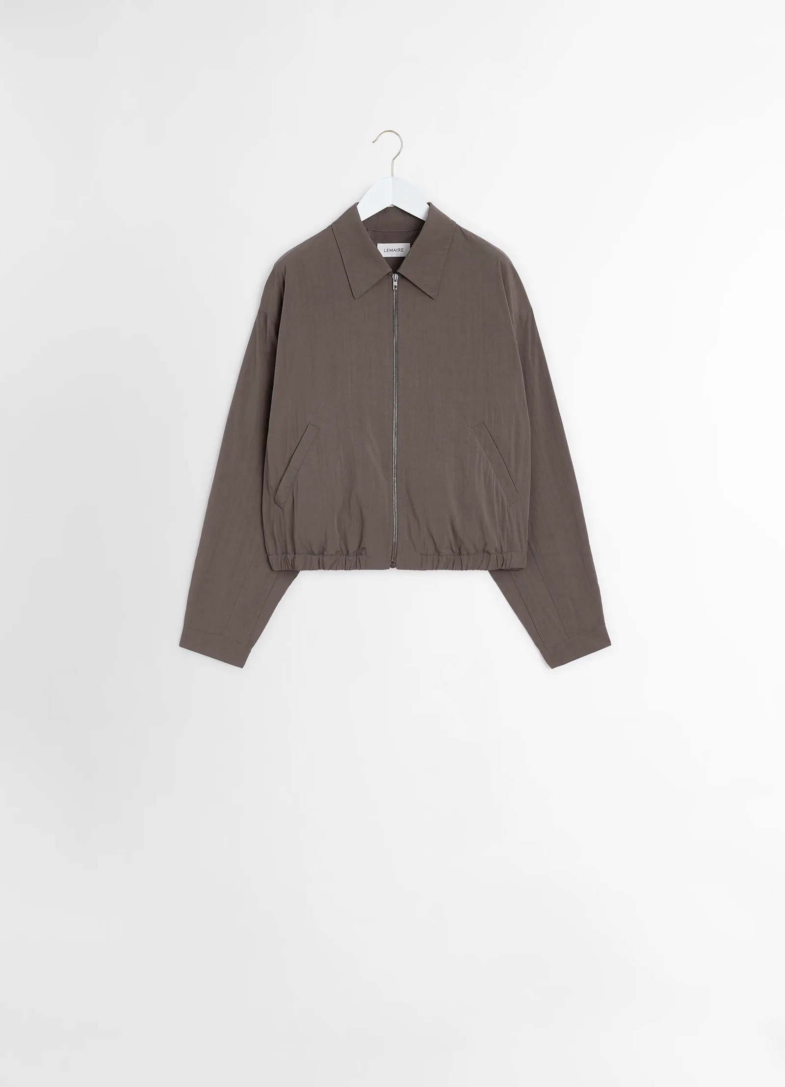 Zipped blouson in technical lyocell, product shot, hanging display minimalist pockets