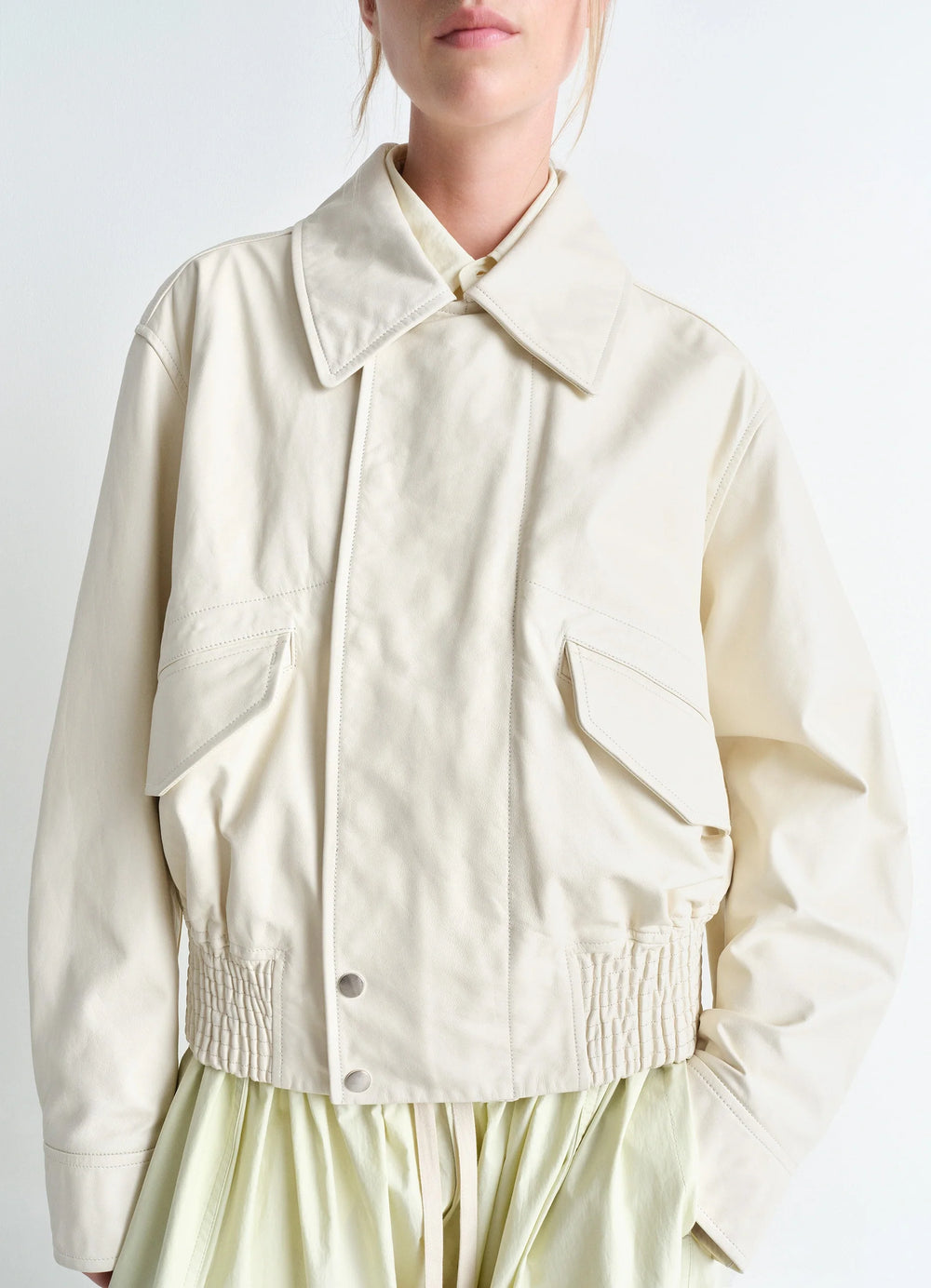 Lemaire Leather Blouson in Soft Nappa Cow Leather, model shot, close-up front view elasticated waistband