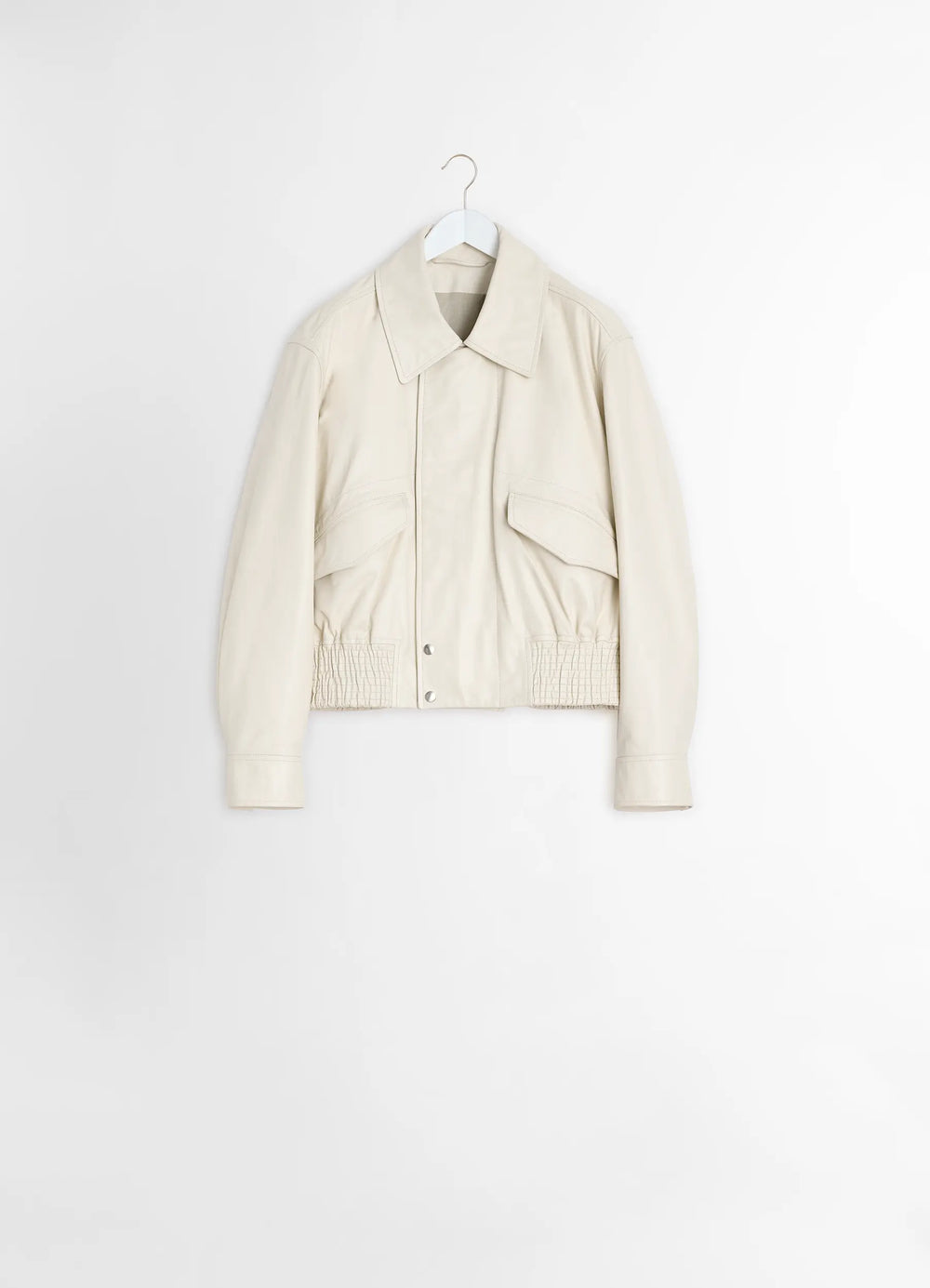 Lemaire Leather Blouson in Soft Nappa Cow Leather, product shot, hanging display angle dual front pockets, full sleeves