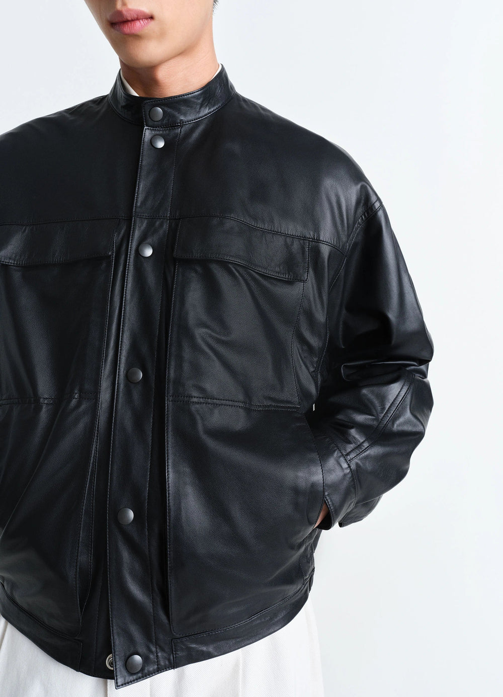 Soft Boxy Blouson in Black Lamb Leather, model shot, side angled view snap-button closure