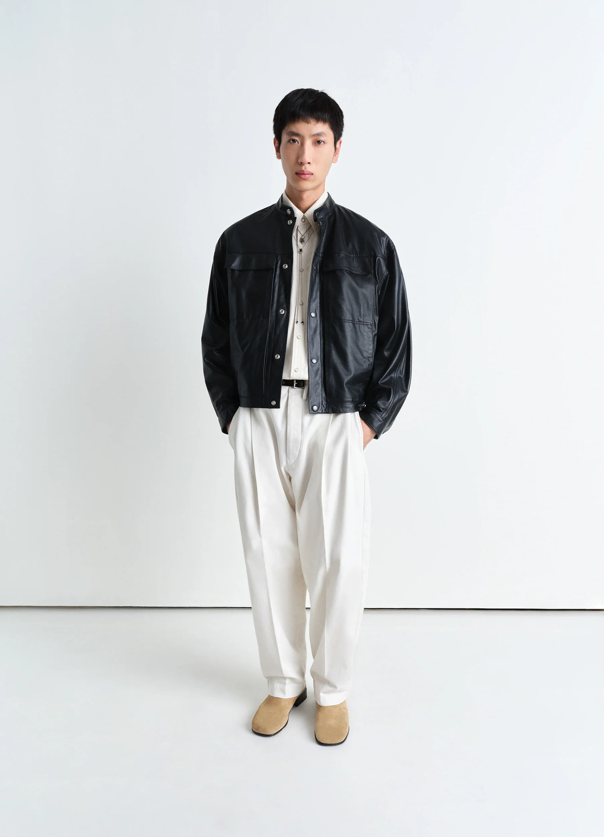 Soft boxy blouson in black lamb leather, model shot, front view patch pockets