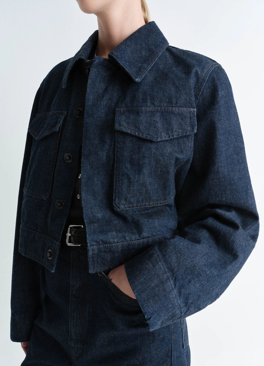 Lemaire Two Pocket Cropped Jacket in Deep Indigo Heavy Denim, model shot, side view two chest pockets