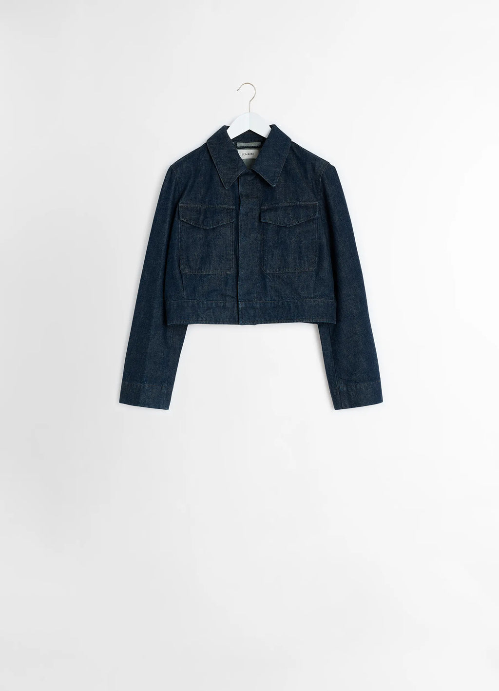 Lemaire Two Pocket Cropped Jacket in Deep Indigo Heavy Denim, product shot, hanging display classic collar, hemline details
