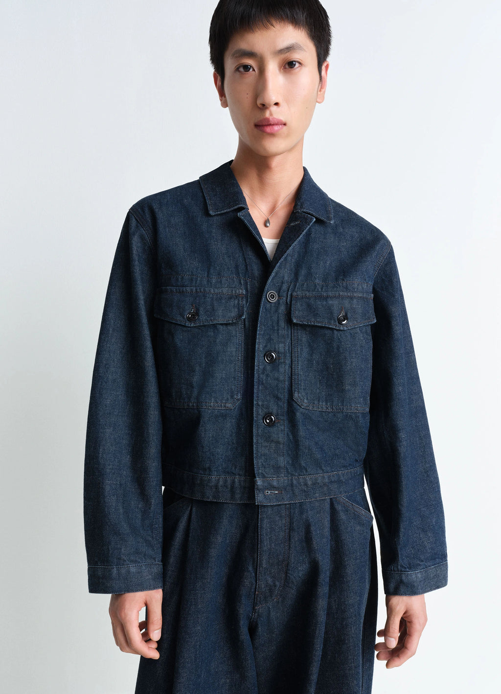 Lemaire Trucker Jacket in Deep Indigo Heavy Denim, model shot, Front view Boxy shape workwear collar