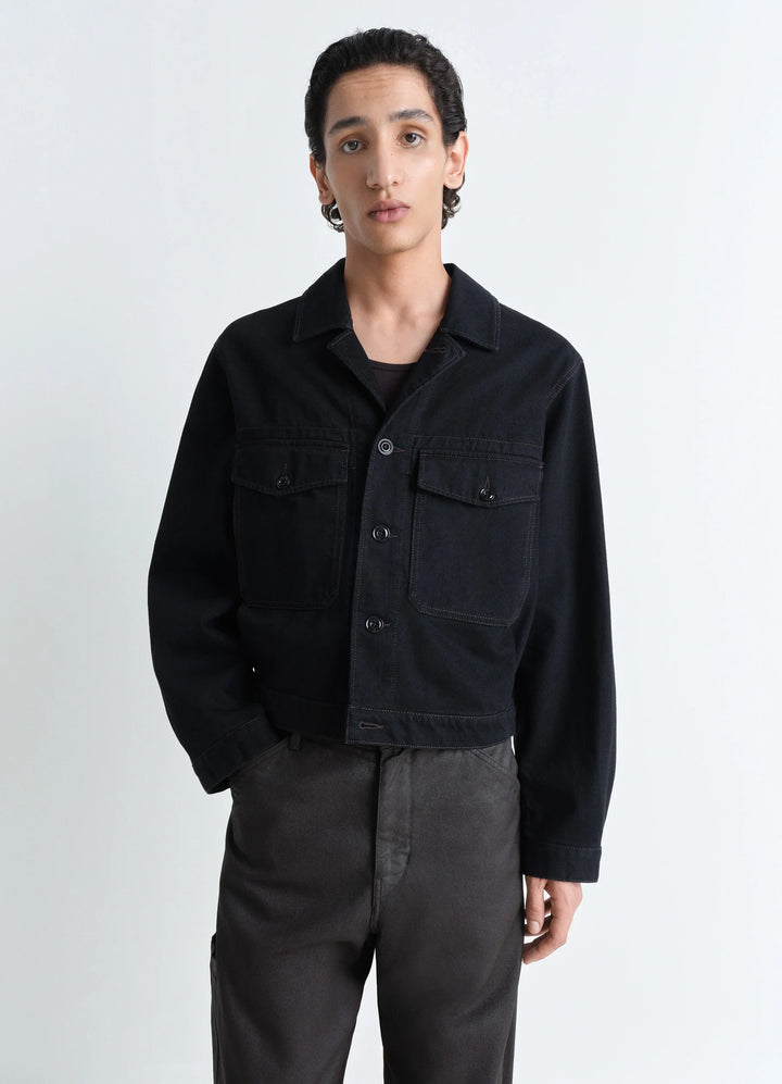 Lemaire Trucker Jacket in Deep Black Heavy Denim, model shot, Front view Boxy shape workwear collar