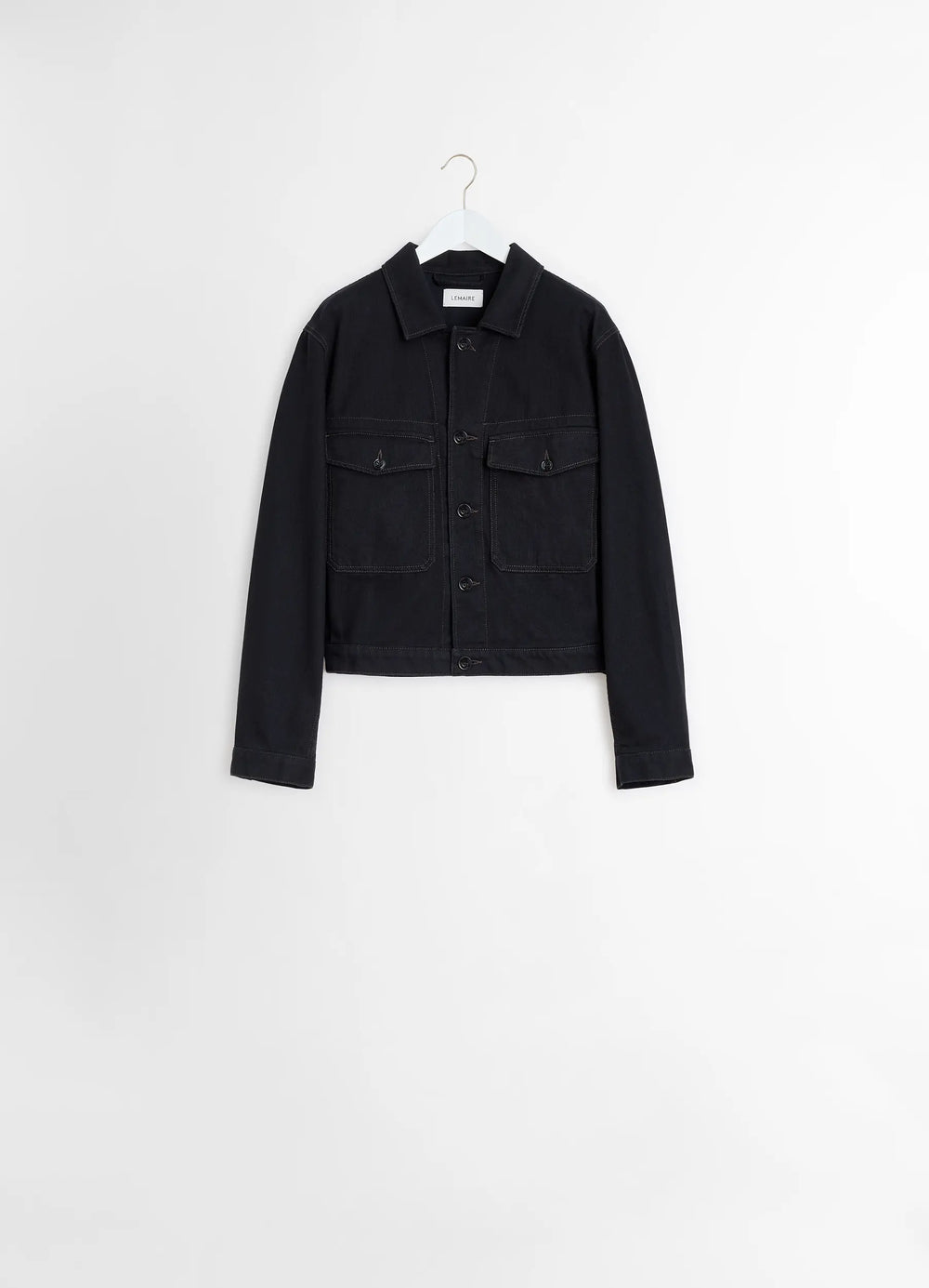 Lemaire Trucker Jacket in Deep Black Heavy Denim, product shot, front hem level view boxy fit, patch pockets