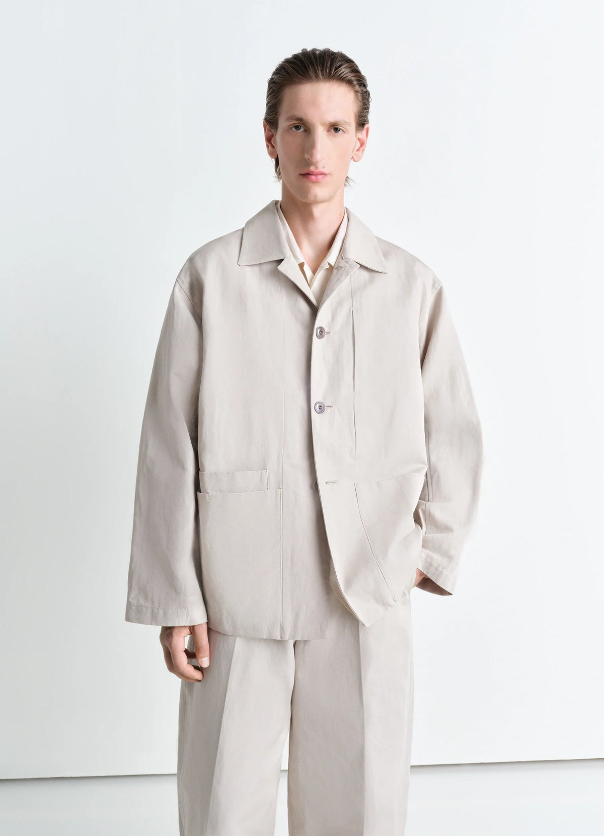 Lemaire Boxy SB Workwear Jacket in Cotton Linen Gabardine, model shot, Front view Boxy cut, adjustable cuffs