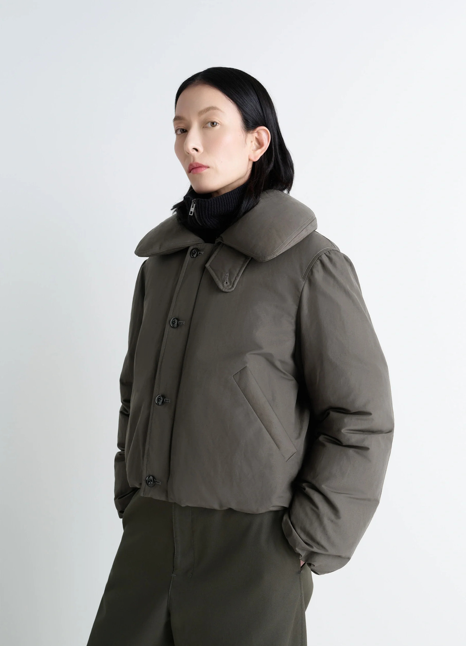 Lemaire short puffer blouson in linen cotton blend, model shot, side front view feather-filled, wide collar