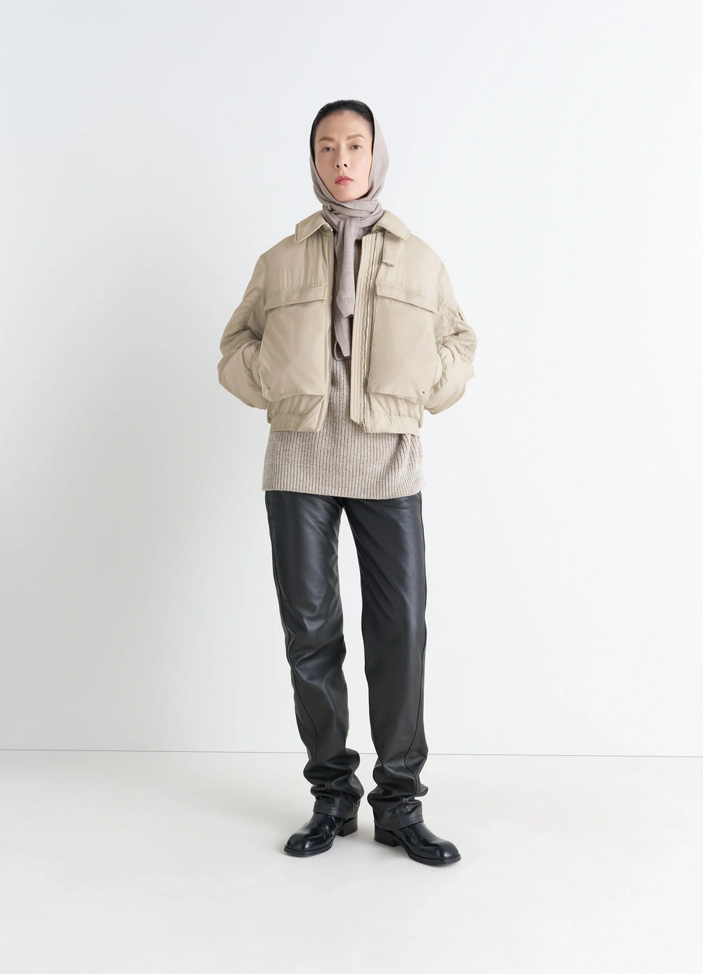 Lemaire Short Bomber in Beige Lightweight Nylon, model shot, front view ribbed cuffs, zip closure