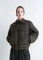 Lemaire Short Bomber in Olive Water-Repellent Nylon, model shot, Front View Removable Collar, Gusseted Pockets