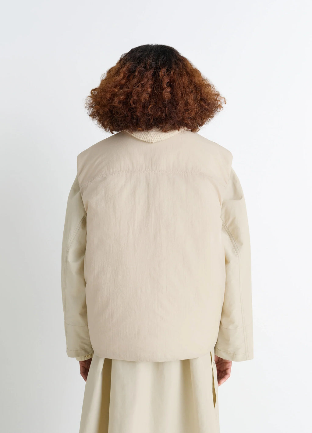 Lemaire Wadded Gilet with Pockets in Beige Water-Repellent Nylon, model shot, back view rear shoulder seam detail