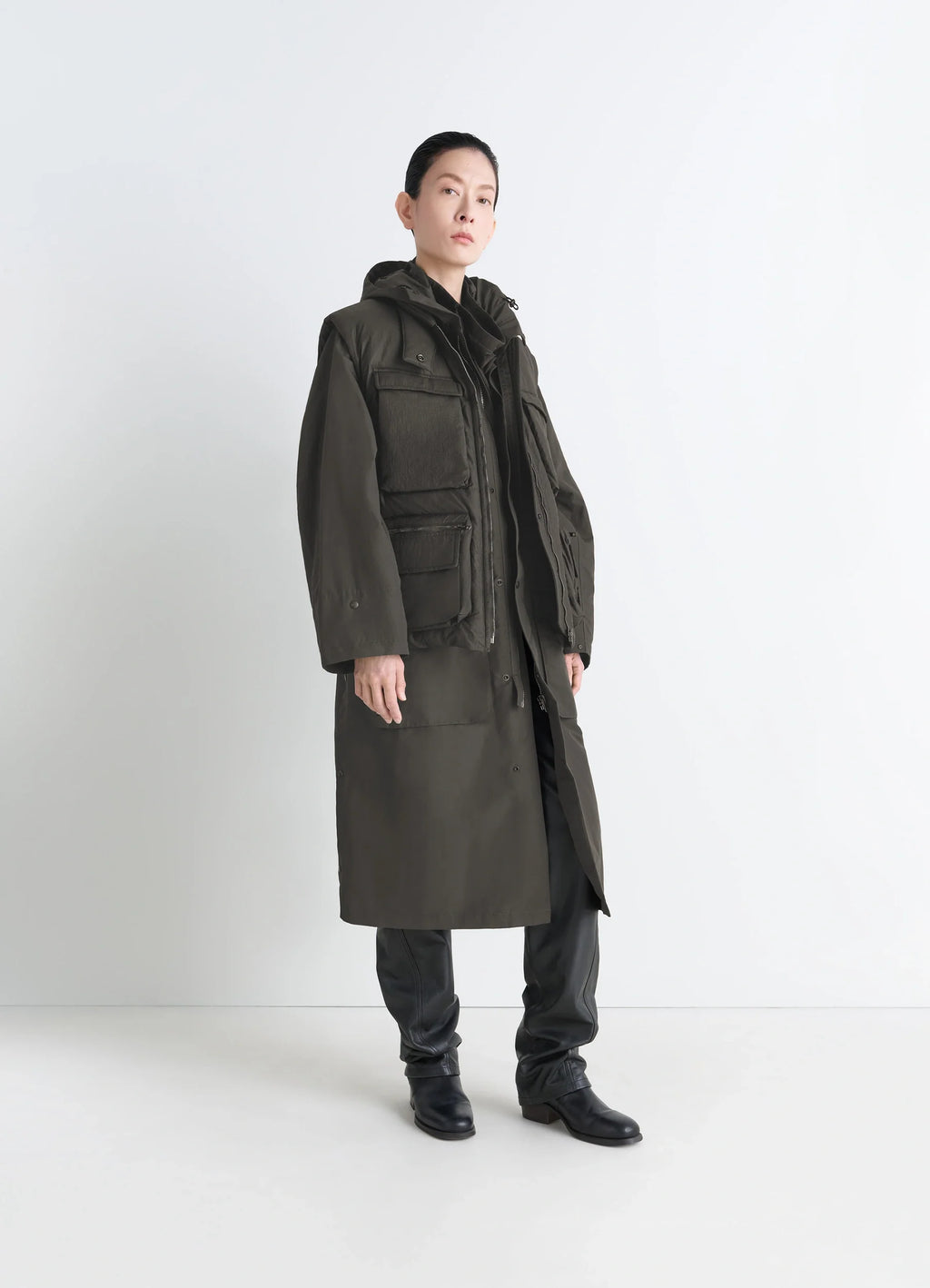 Lemaire Wadded Gilet in Deep Brown Nylon, model shot, side view worn with long coat