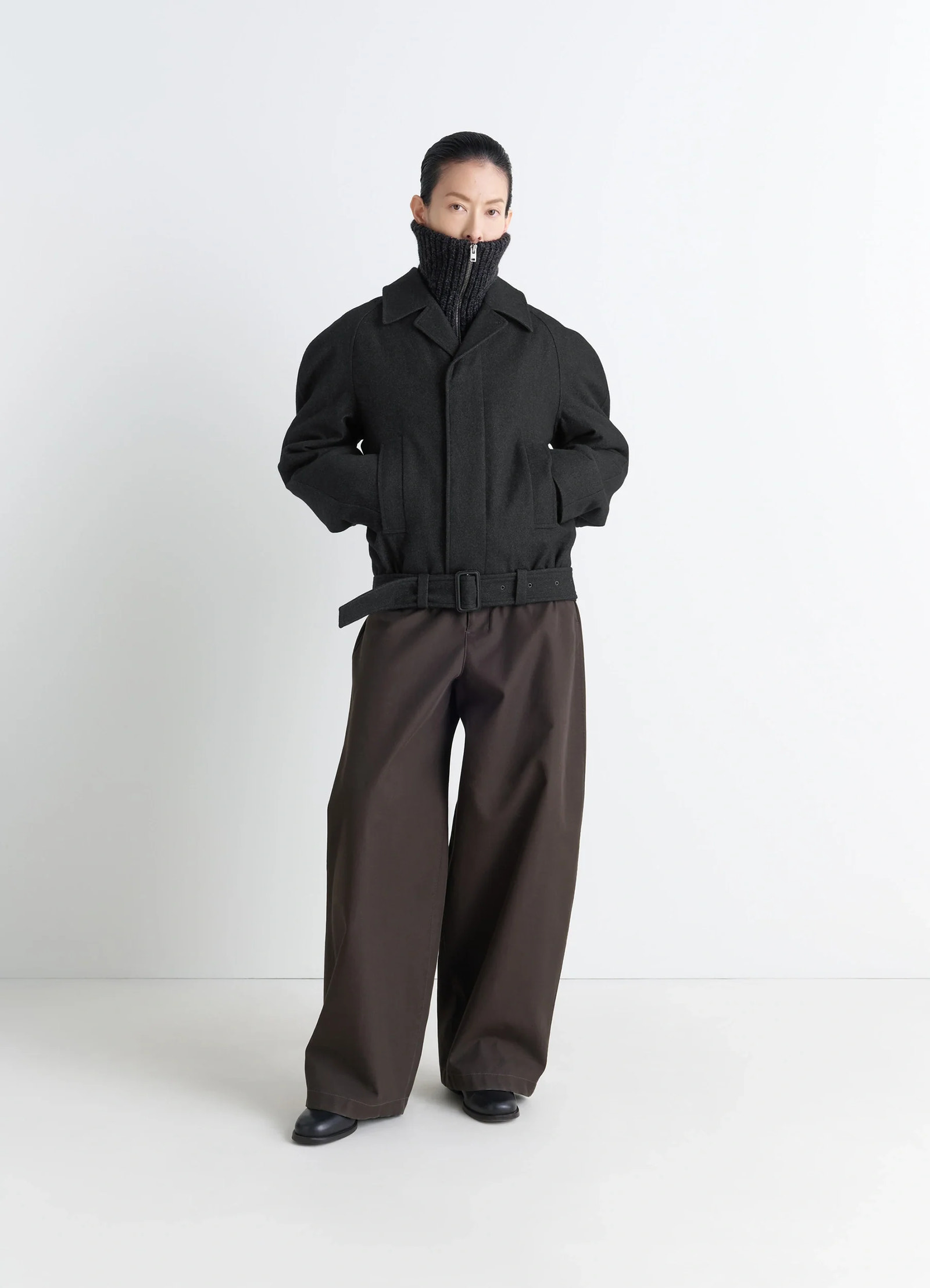 Lemaire raglan sleeve short coat in rws wool and cotton twill, model shot, three-quarter view androgynous belt detail