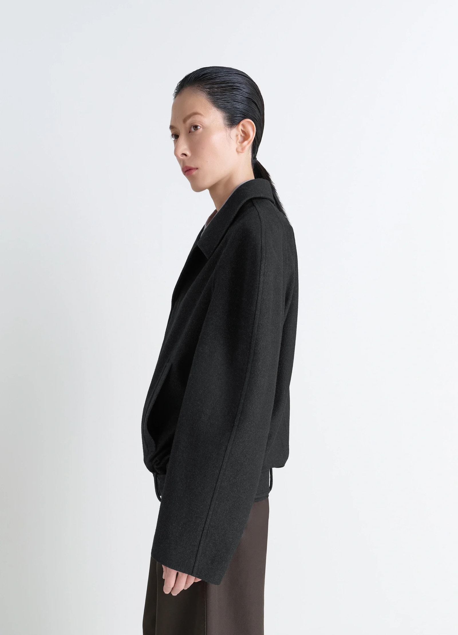 Lemaire raglan sleeve short coat in rws wool and cotton twill, model shot, side view relaxed drape