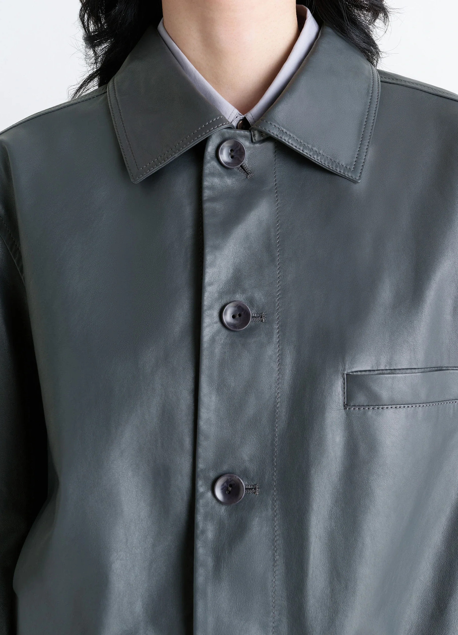 Lemaire soft leather blouson in soft cow leather, model shot, close-up detail shot pocketed button placket