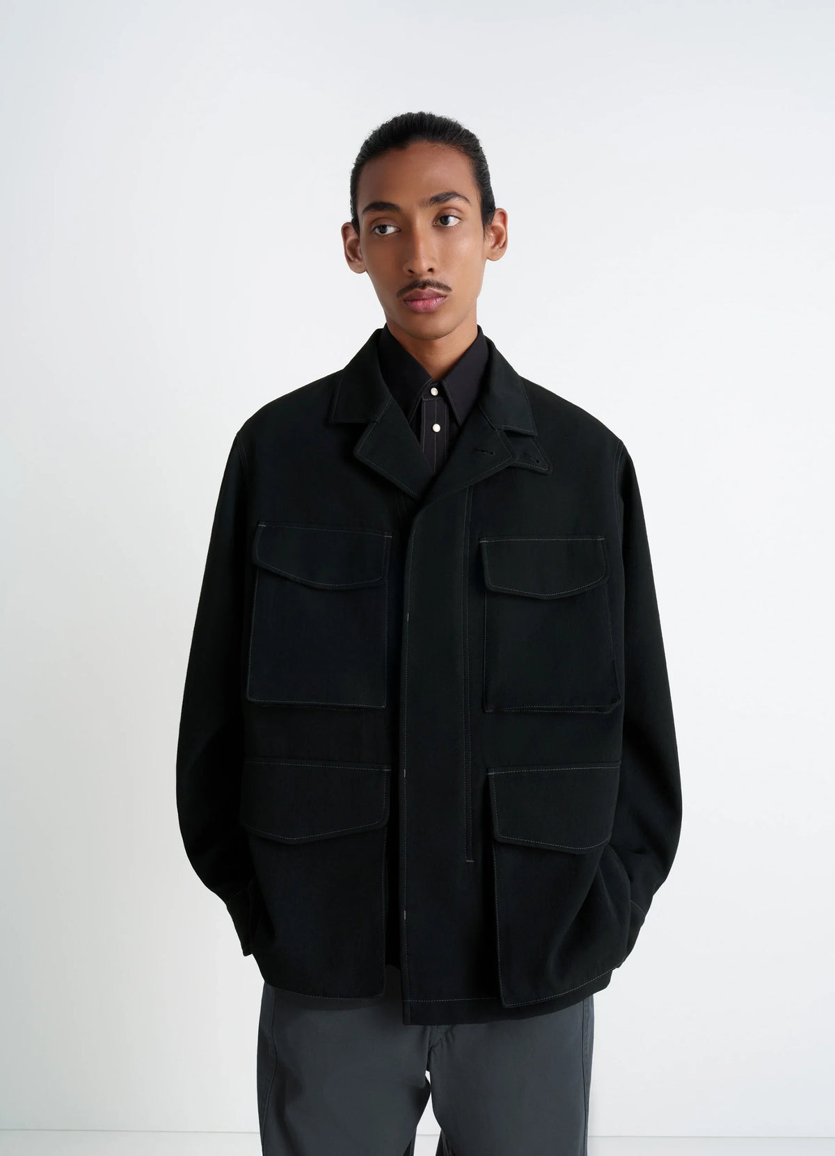 Soft Field Jacket in Black Wool Twill, model shot, Front view Utilitarian pockets
