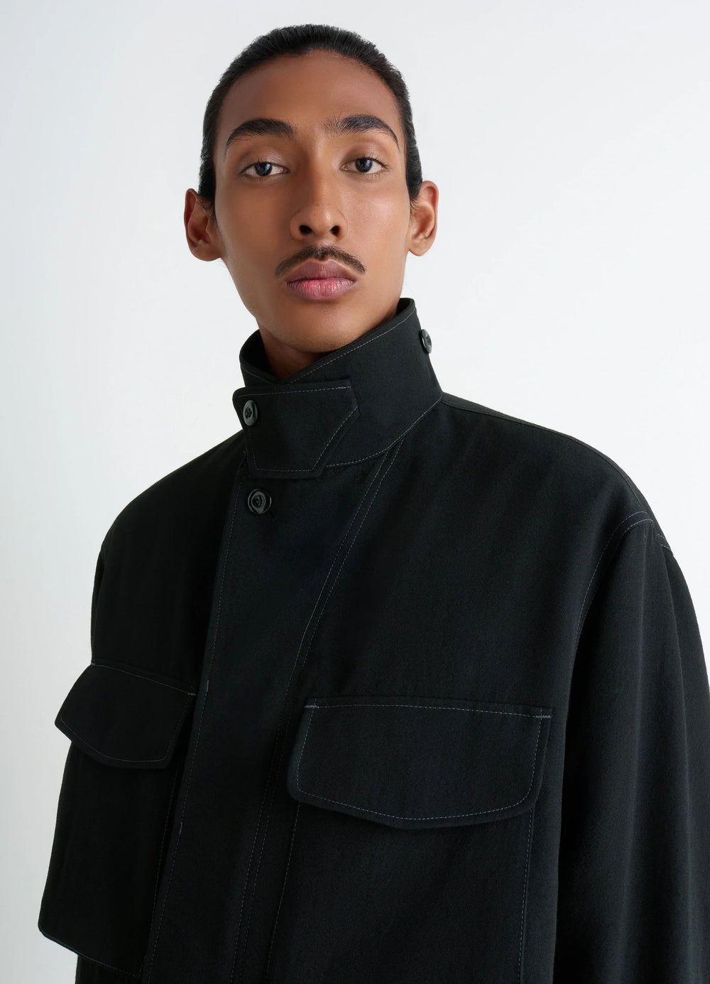 Soft Field Jacket in Black Wool Twill, model shot, close-up high collar structured shoulder