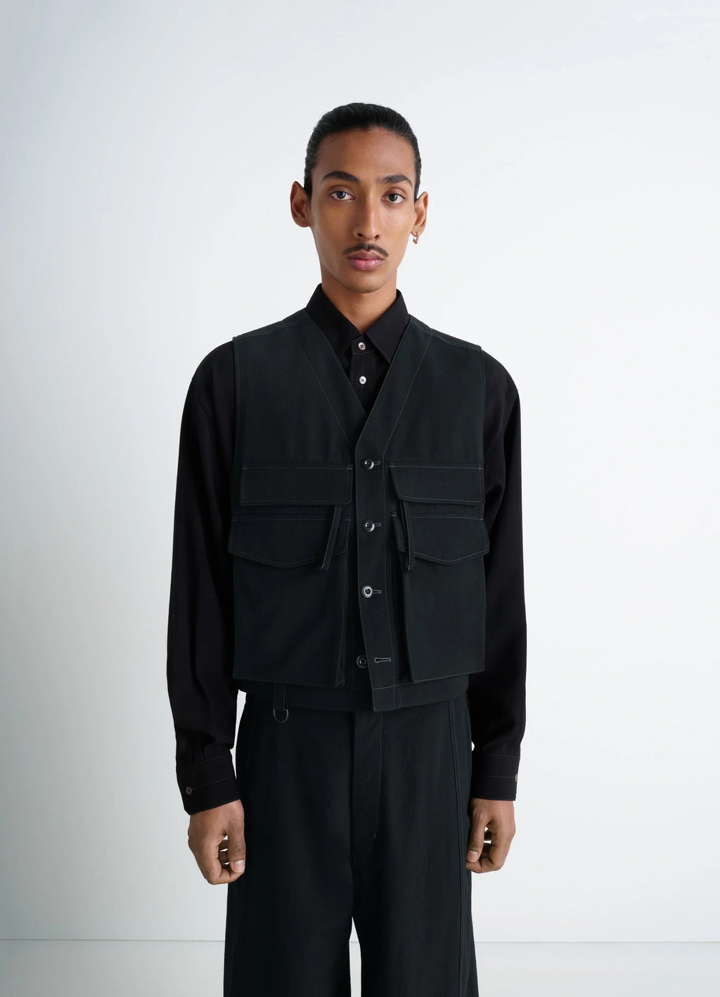 UTILITY GILET in light wool twill, model shot, front view utilitarian design