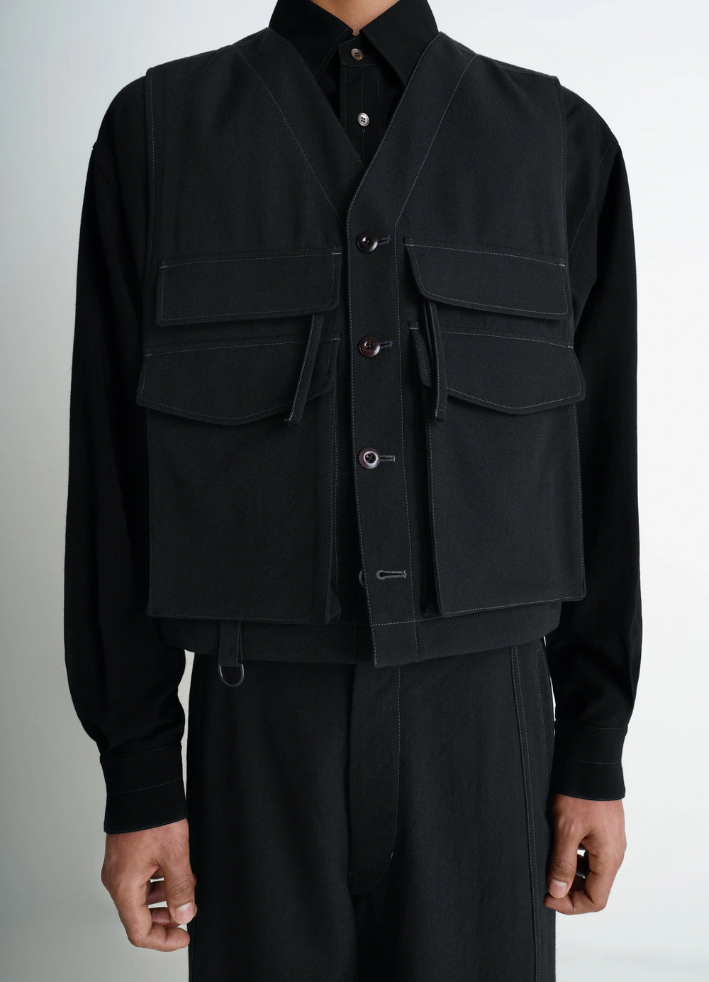 UTILITY GILET in light wool twill, model shot, mid-torso view buttoned front