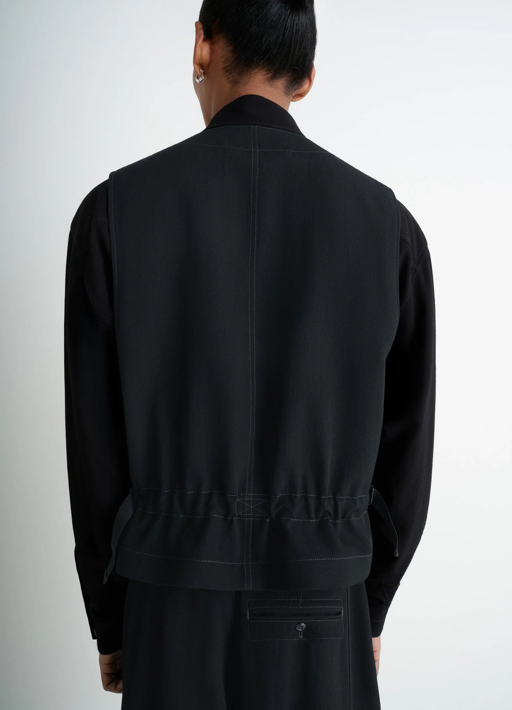 UTILITY GILET in light wool twill, model shot, back view seam detailing