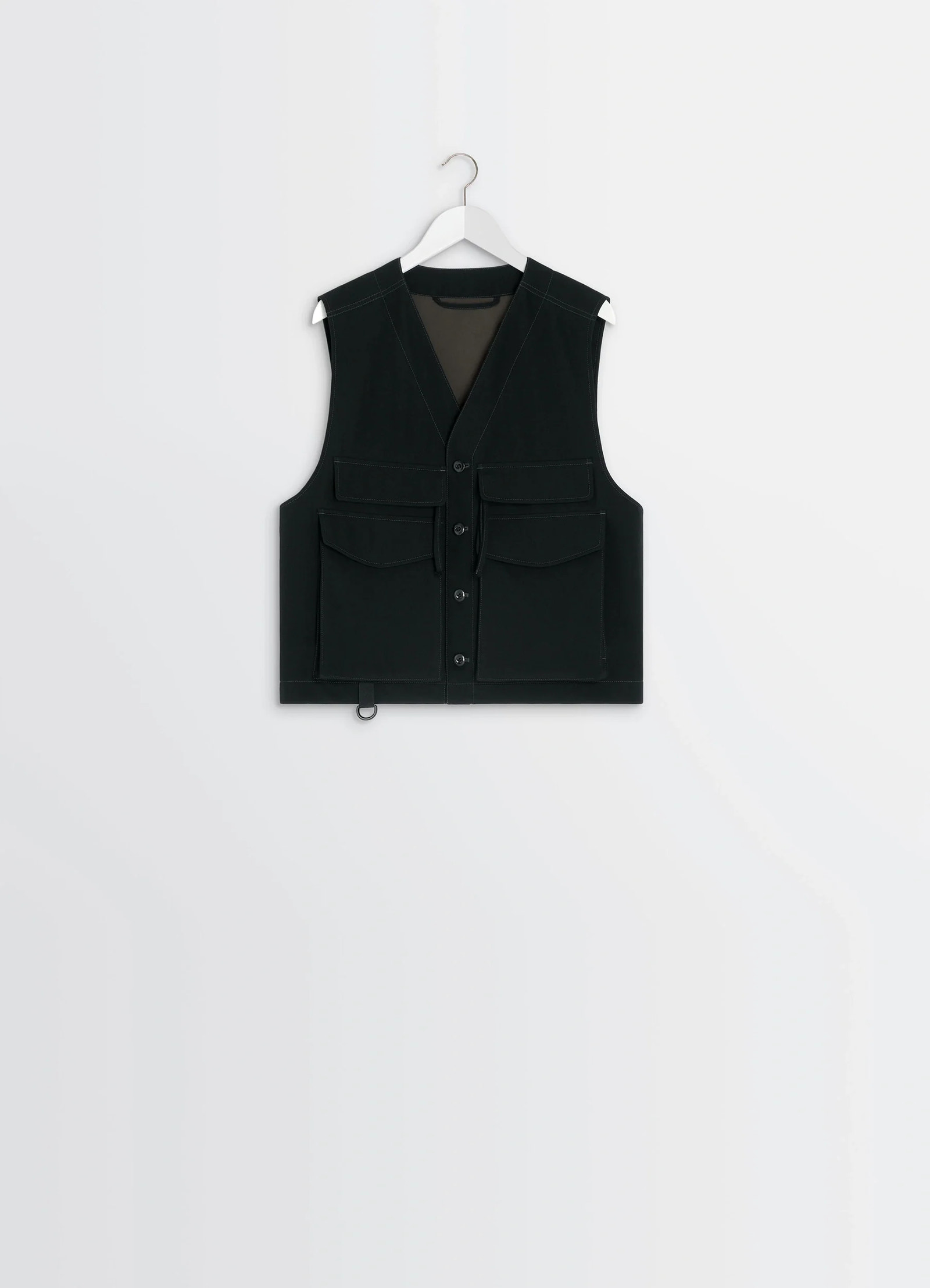 Utility gilet in light wool twill, product shot, hanging view shoulder seam focus