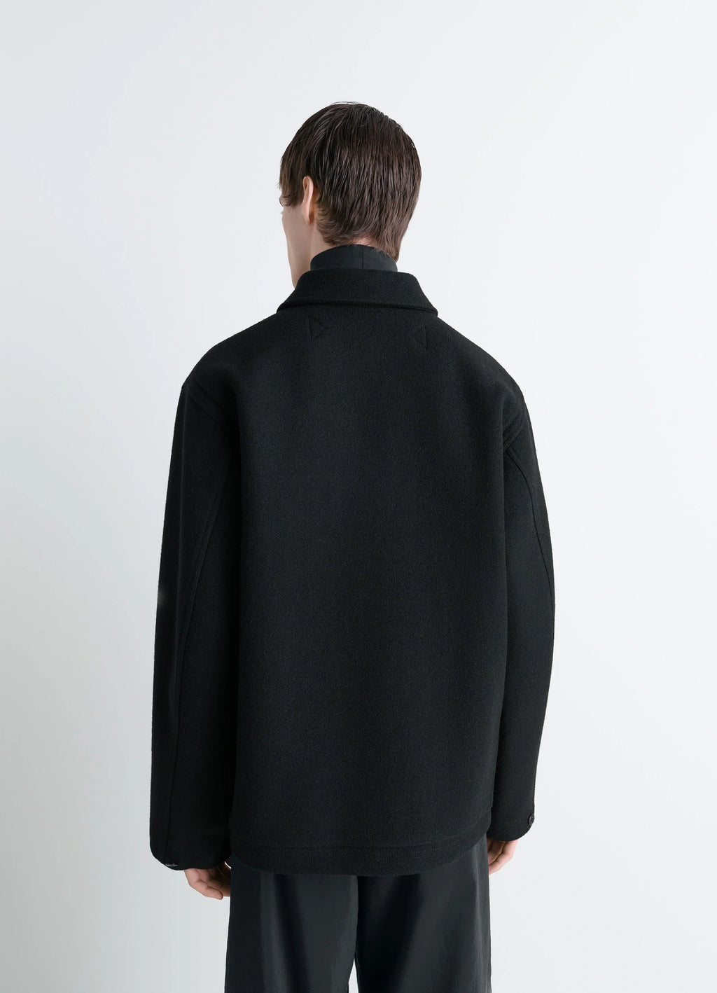 Lemaire Utility Jacket in Black Melton Wool, model shot, back view straight hem, dropped shoulders