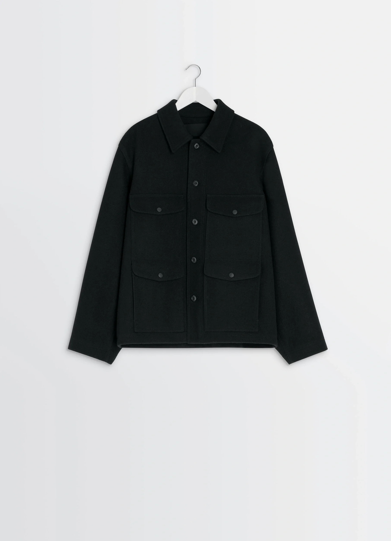 Lemaire utility jacket in black melton wool, product shot, angled overhead top view buttoned chest pockets