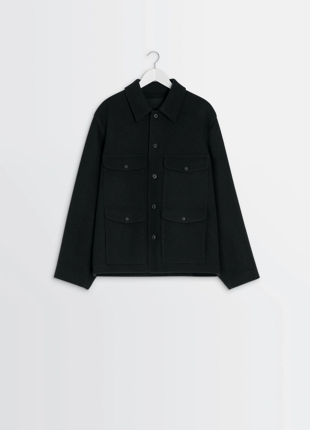 Lemaire Utility Jacket in Black Melton Wool, product shot, angled overhead top view buttoned chest pockets