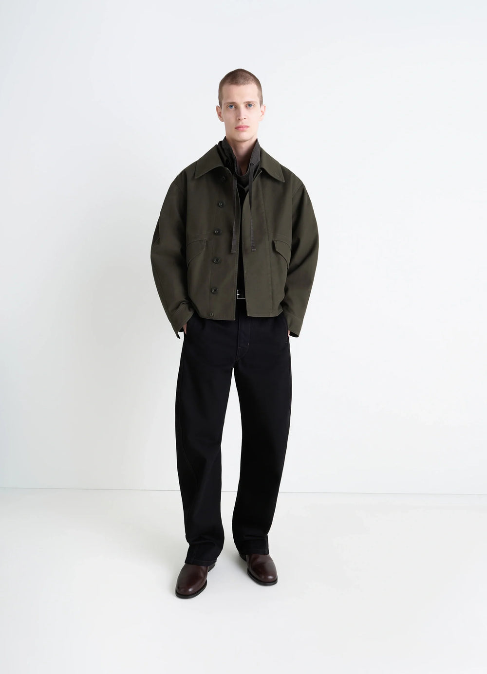 Lemaire Boxy Blouson in Olive Cotton Twill, model shot, three-quarter view contrast topstitching